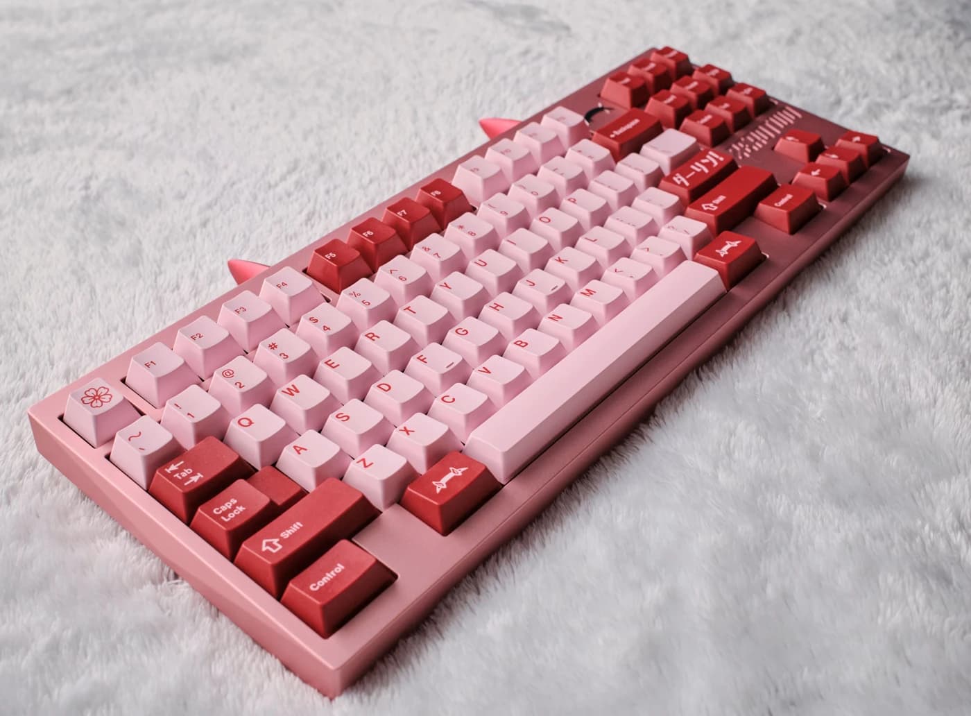 Code:002 prototype keyboard photographed on a light fabric surface.