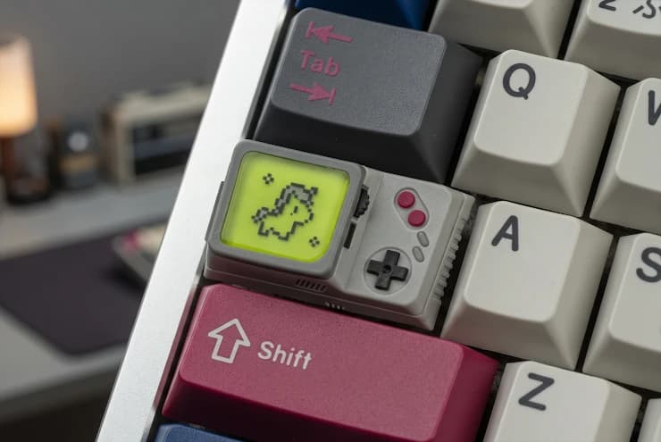 The wider DMG Handheld stepped Caps Lock keycap installed between Tab and Shift on a keyboard.