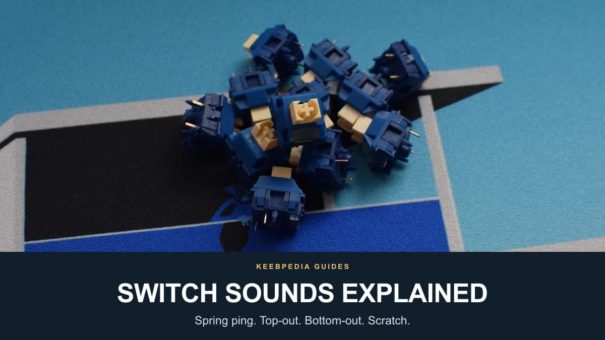 Blue keyboard switches with cream-colored stems centered on a teal desk mat above the title SWITCH SOUNDS EXPLAINED.