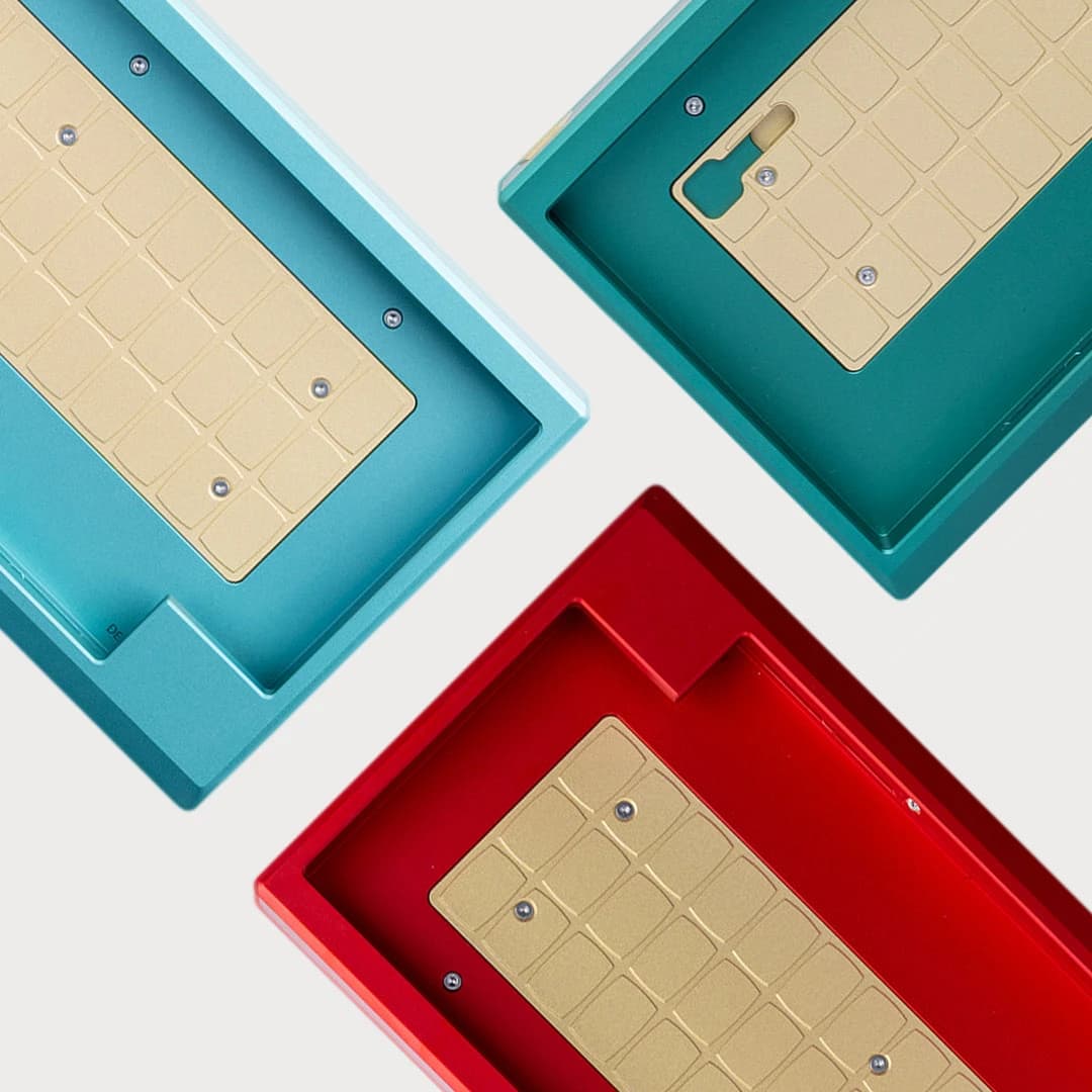 RAE’s official image showing blue, green and red Aurum case interiors and brass weights.