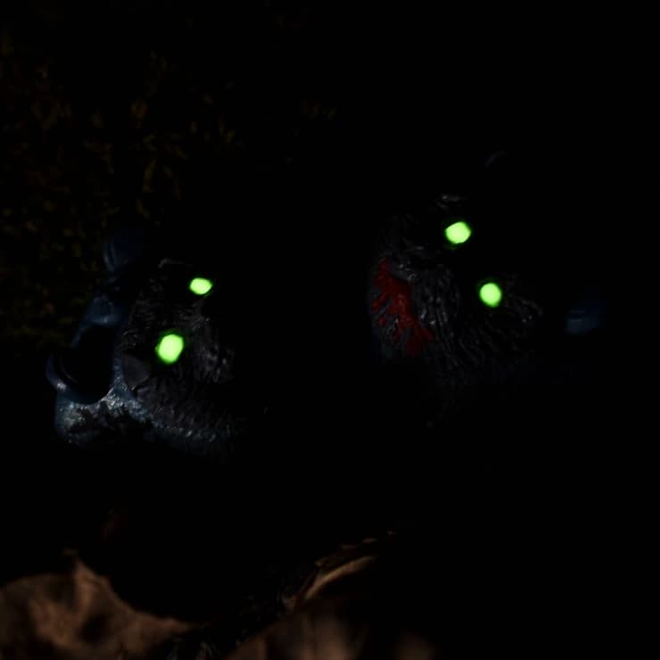 Catjams keycaps with glowing green eyes in the dark.